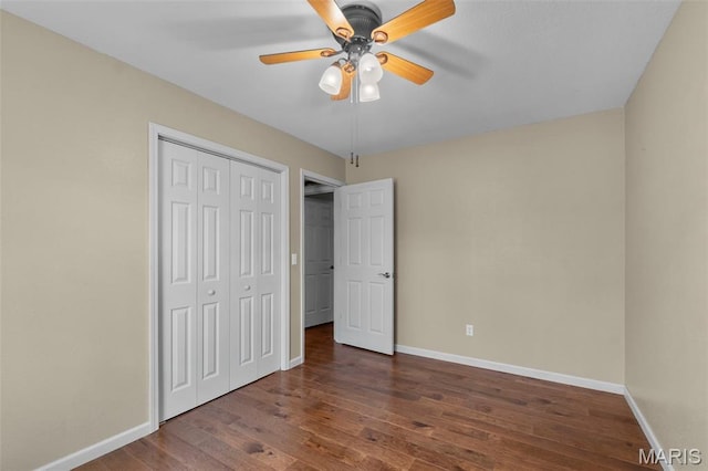 732 Woodridge Ln, Perryville, MO 63775 - unfurnished bedroom with baseboards, wood finished floors, a closet, and a ceiling fan