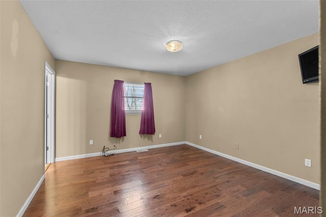 732 Woodridge Ln, Perryville, MO 63775 - spare room featuring wood finished floors and baseboards