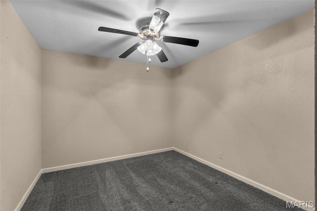732 Woodridge Ln, Perryville, MO 63775 - unfurnished room featuring a ceiling fan, dark carpet, and baseboards