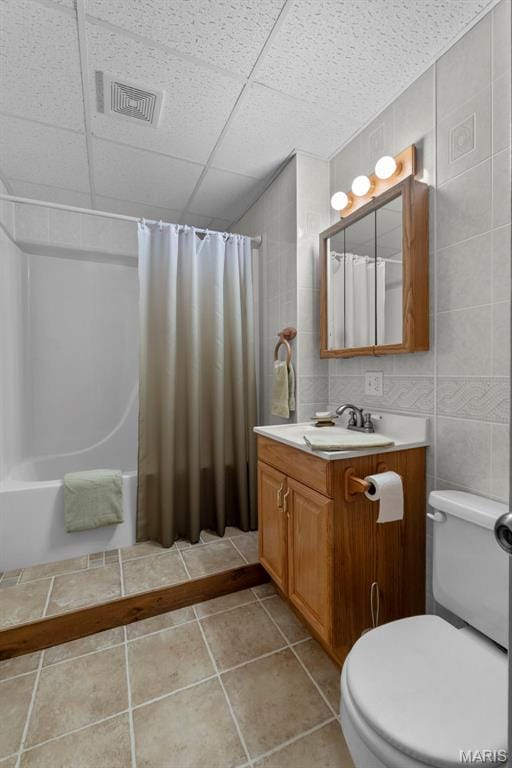 732 Woodridge Ln, Perryville, MO 63775 - bathroom featuring shower / bath combo, vanity, toilet, tile patterned flooring, and tile walls