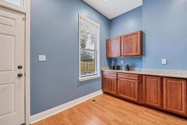 4125 Chouteau Ave, Saint Louis, MO 63110 - bar featuring light wood-style floors and baseboards