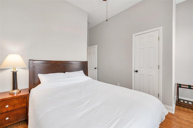 4125 Chouteau Ave, Saint Louis, MO 63110 - bedroom featuring wood finished floors, baseboards, and a ceiling fan