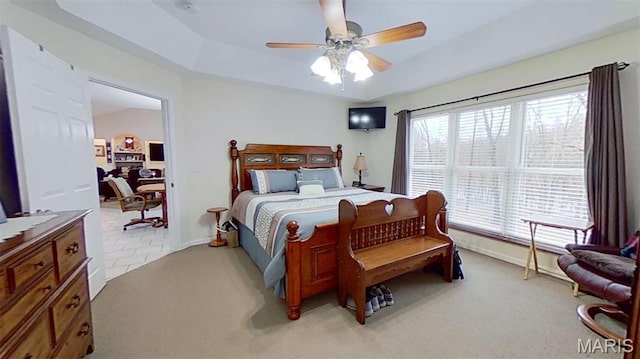 bedroom with light carpet, baseboards, and ceiling fan