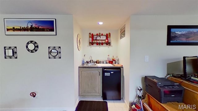 indoor bar with light tile patterned floors, fridge, recessed lighting, and baseboards