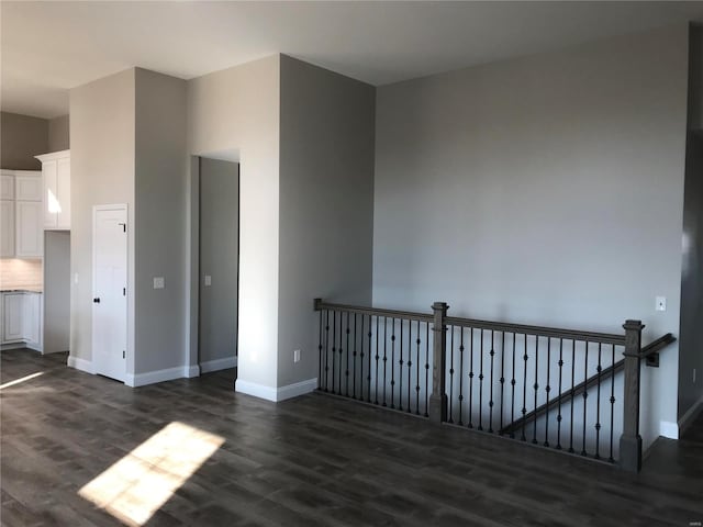 1605 Sugar Creek Dr, Festus, MO 63028 - spare room with dark wood-style floors and baseboards