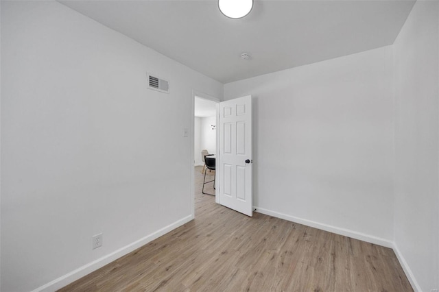 17 S Floridale Dr, Saint Louis, MO 63135 - unfurnished room featuring wood finished floors and baseboards