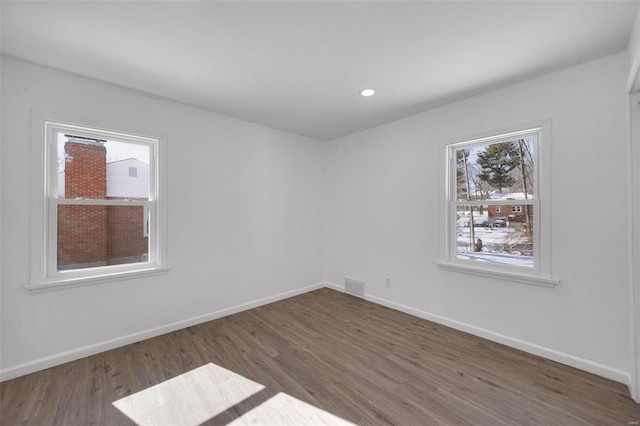 17 S Floridale Dr, Saint Louis, MO 63135 - empty room featuring wood finished floors, baseboards, and recessed lighting