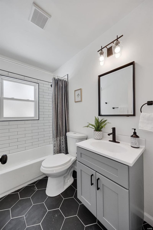 17 S Floridale Dr, Saint Louis, MO 63135 - bathroom featuring toilet, vanity, shower / tub combo with curtain, and tile patterned floors