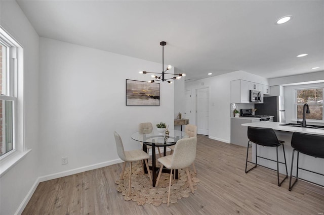 17 S Floridale Dr, Saint Louis, MO 63135 - dining room with light wood-style flooring, baseboards, recessed lighting, and a chandelier