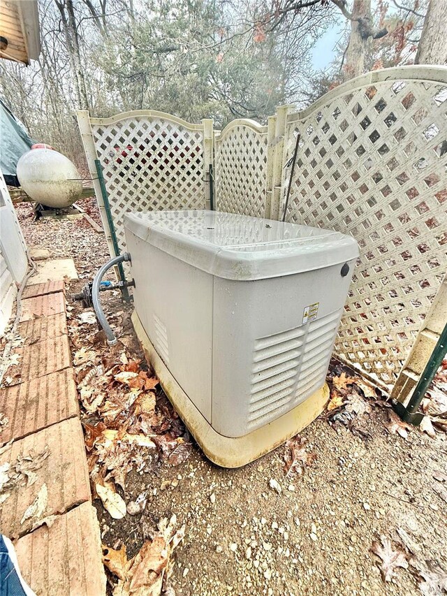 10063 Mockingbird Dr, Holiday Shores, MO 63624 - exterior view of a power unit and propane tank