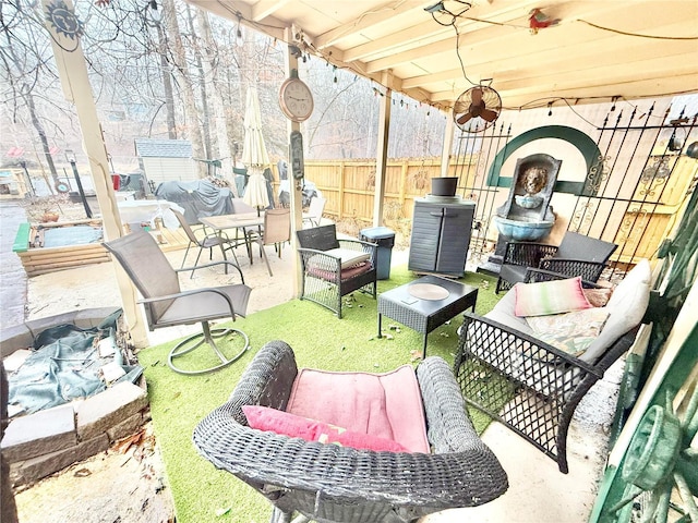 10063 Mockingbird Dr, Holiday Shores, MO 63624 - view of patio with an outdoor hangout area and fence