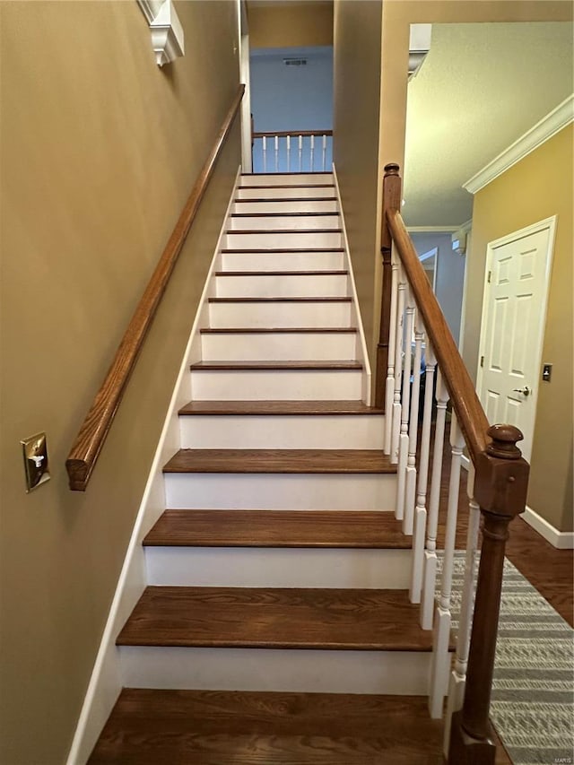 10 Cherokee Rdg, Sikeston, MO 63801 - staircase with wood finished floors, baseboards, and crown molding