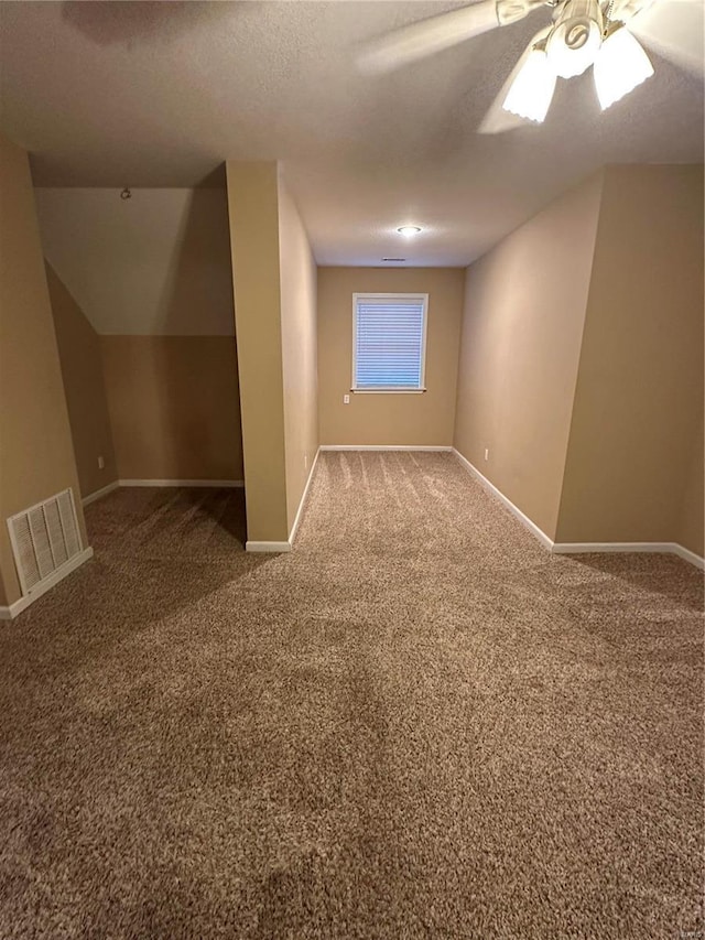 10 Cherokee Rdg, Sikeston, MO 63801 - bonus room featuring baseboards, carpet, ceiling fan, and a textured ceiling