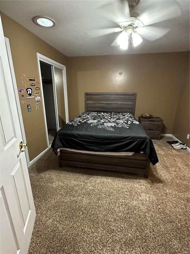 10 Cherokee Rdg, Sikeston, MO 63801 - carpeted bedroom with baseboards, a ceiling fan, a closet, and a textured ceiling