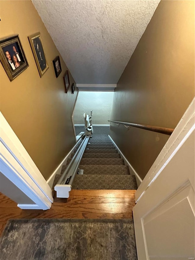 10 Cherokee Rdg, Sikeston, MO 63801 - staircase with a textured ceiling and carpet