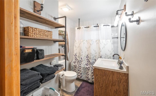 801 E 14th St, Rolla, MO 65401 - bathroom featuring a shower with shower curtain, vanity, toilet, and wood finished floors