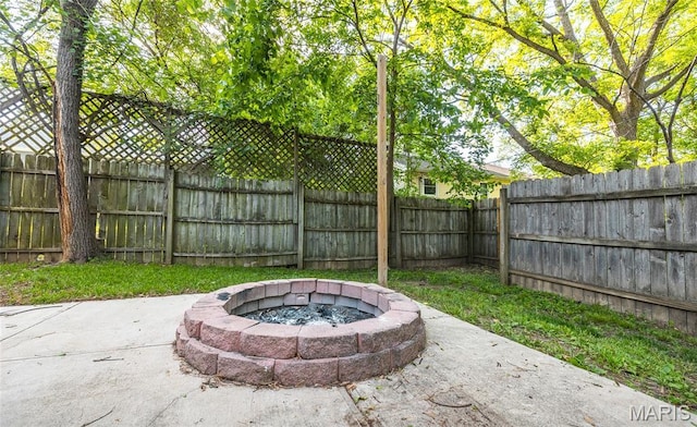 801 E 14th St, Rolla, MO 65401 - view of patio featuring a fire pit and a fenced backyard