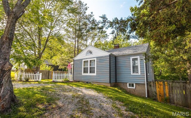 801 E 14th St, Rolla, MO 65401 - view of front of property featuring fence and a chimney