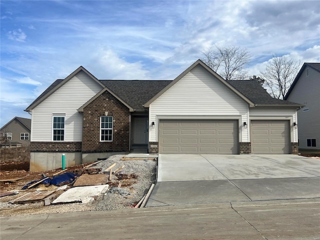 1066 Bloomfield Dr, Eureka, MO 63025 - view of front of property featuring brick siding, a garage, driveway, and roof with shingles