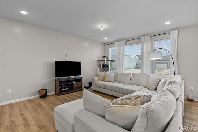 138 Rhythm Point Dr, Saint Peters, MO 63376 - living room featuring baseboards, light wood-style floors, and recessed lighting