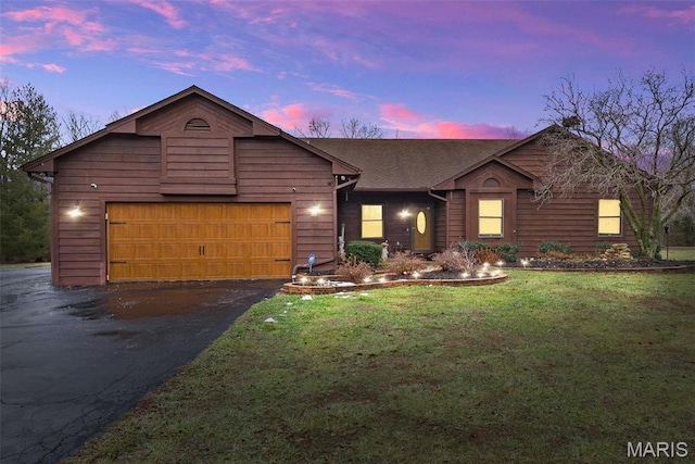 23 Falling Leaf Dr, Lake St Louis, MO 63367 - view of front of property with an attached garage, asphalt driveway, and a yard
