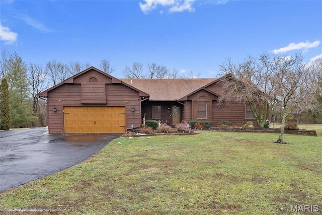23 Falling Leaf Dr, Lake St Louis, MO 63367 - view of front of property with driveway, a front lawn, and a garage