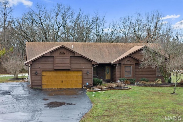 23 Falling Leaf Dr, Lake St Louis, MO 63367 - rustic home featuring asphalt driveway, a front yard, a garage, and a shingled roof