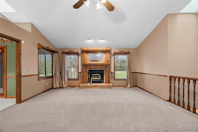 23 Falling Leaf Dr, Lake St Louis, MO 63367 - unfurnished living room with carpet flooring, lofted ceiling, a brick fireplace, ceiling fan, and baseboards