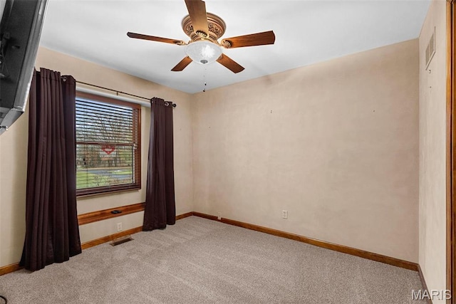 23 Falling Leaf Dr, Lake St Louis, MO 63367 - spare room with light carpet, baseboards, and ceiling fan