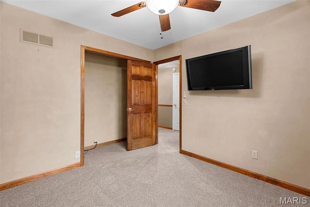 23 Falling Leaf Dr, Lake St Louis, MO 63367 - unfurnished bedroom featuring light colored carpet, baseboards, a closet, and ceiling fan
