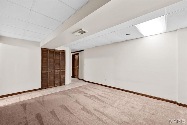 23 Falling Leaf Dr, Lake St Louis, MO 63367 - finished below grade area with a paneled ceiling, carpet floors, and baseboards