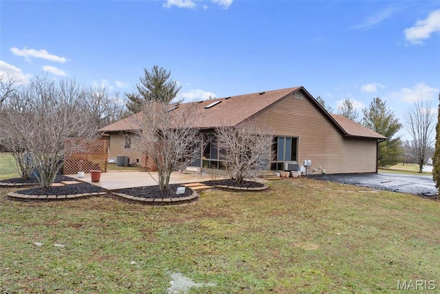 23 Falling Leaf Dr, Lake St Louis, MO 63367 - back of property with a patio, a yard, and central air condition unit