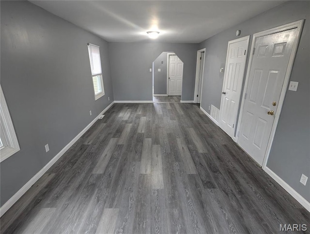 10544 Decker Ave, Saint Louis, MO 63114 - spare room featuring dark wood-style flooring and baseboards