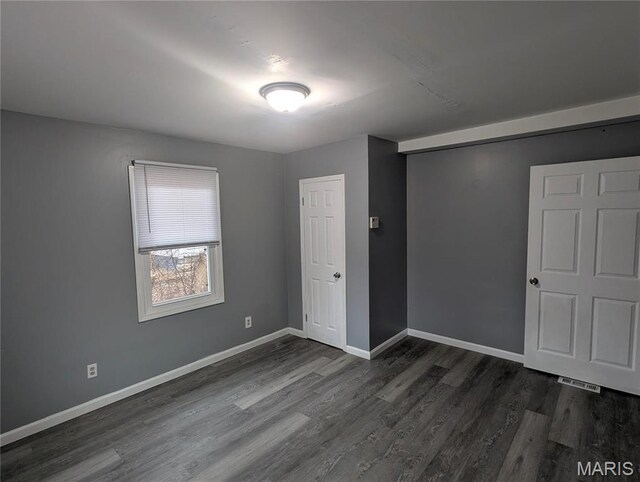 10544 Decker Ave, Saint Louis, MO 63114 - unfurnished room featuring dark wood-style floors and baseboards