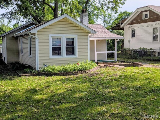 10544 Decker Ave, Saint Louis, MO 63114 - view of front facade featuring a chimney
