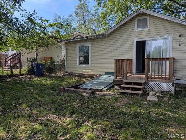 10544 Decker Ave, Saint Louis, MO 63114 - rear view of house featuring a wooden deck
