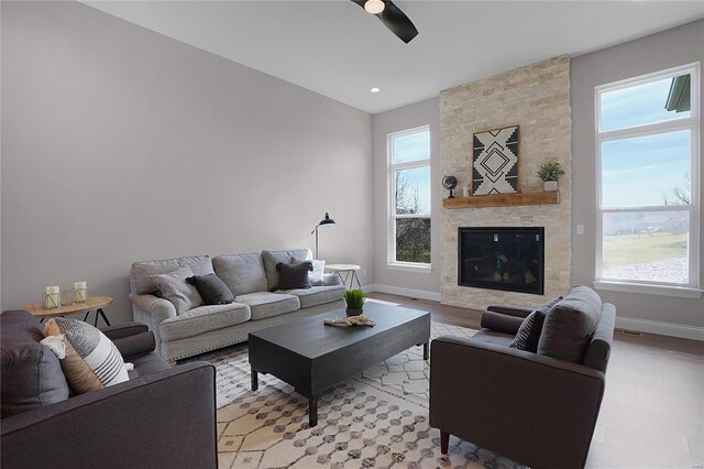 1035 Morgan Meadow Dr, Wentzville, MO 63385 - living room featuring ceiling fan, plenty of natural light, baseboards, and light wood-style flooring