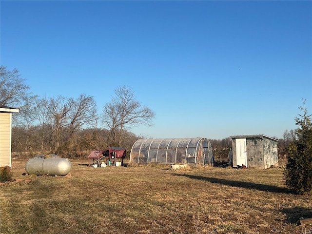 1539 Bcr 628, Puxico, MO 63960 - view of green lawn featuring an outbuilding, a greenhouse, and a storage shed