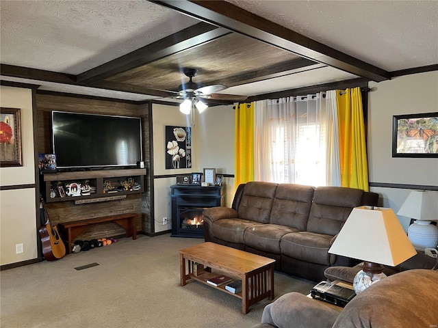 1539 Bcr 628, Puxico, MO 63960 - living room featuring beam ceiling, a textured ceiling, carpet, a ceiling fan, and baseboards