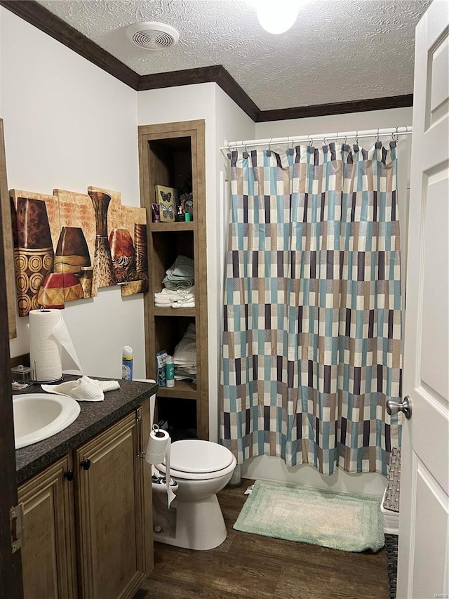 1539 Bcr 628, Puxico, MO 63960 - bathroom featuring ornamental molding, wood finished floors, toilet, a textured ceiling, and vanity