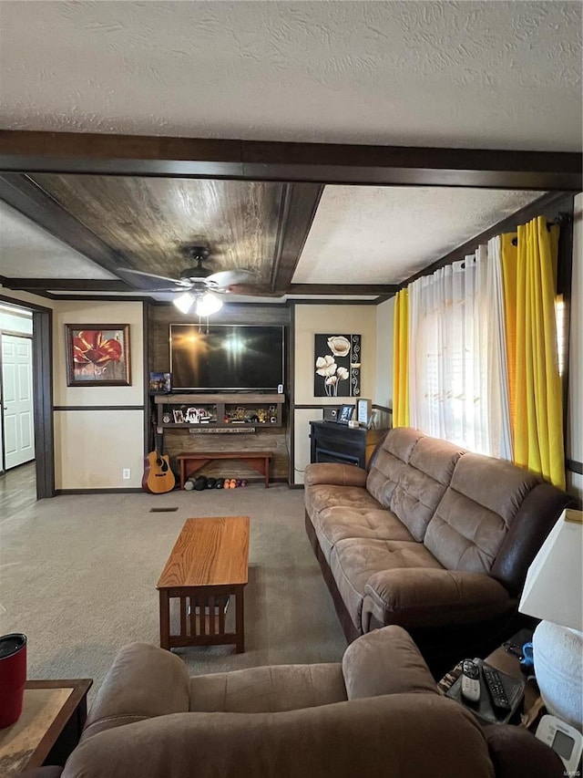 1539 Bcr 628, Puxico, MO 63960 - living room featuring carpet flooring, beam ceiling, and ceiling fan