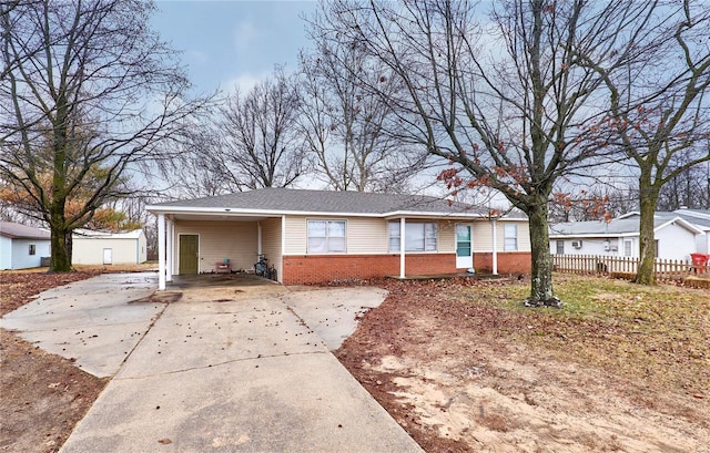 1991 State Highway H, Sikeston, MO 63780 - single story home with brick siding, concrete driveway, fence, and a carport