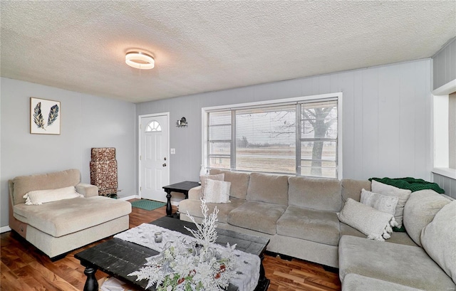 1991 State Highway H, Sikeston, MO 63780 - living area featuring a textured ceiling and wood finished floors