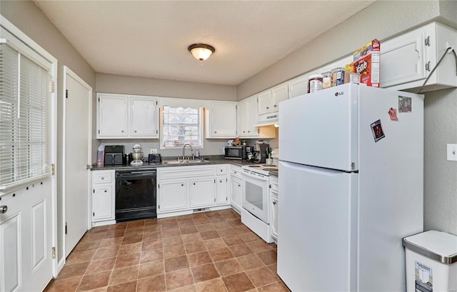 1991 State Highway H, Sikeston, MO 63780 - kitchen featuring black appliances, under cabinet range hood, a sink, dark countertops, and white cabinets