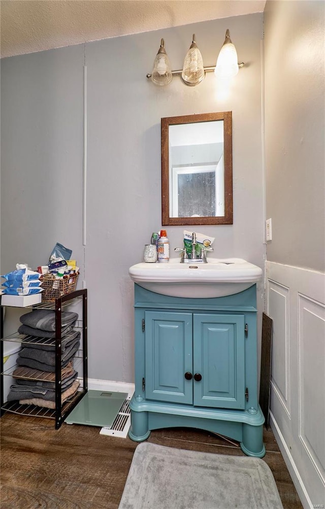 1991 State Highway H, Sikeston, MO 63780 - bathroom with wood finished floors and vanity