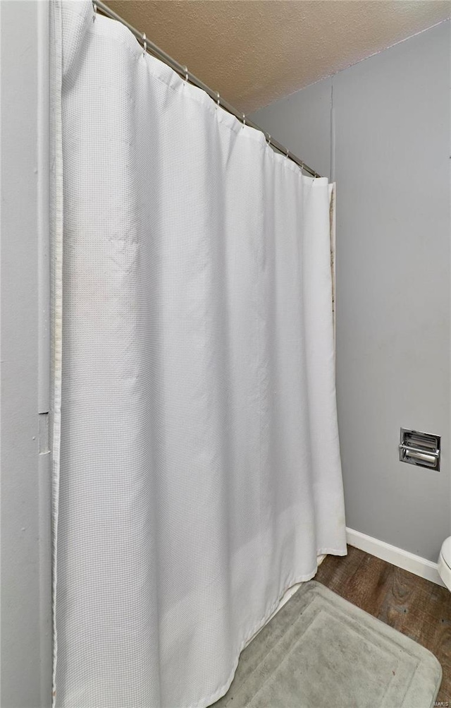 1991 State Highway H, Sikeston, MO 63780 - bathroom featuring baseboards and wood finished floors