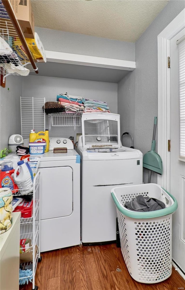 1991 State Highway H, Sikeston, MO 63780 - clothes washing area featuring washing machine and dryer, wood finished floors, and a textured ceiling