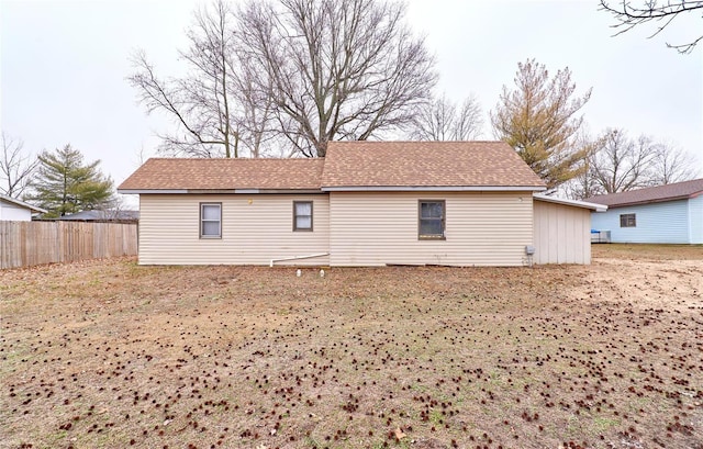 1991 State Highway H, Sikeston, MO 63780 - rear view of property with fence and a shingled roof