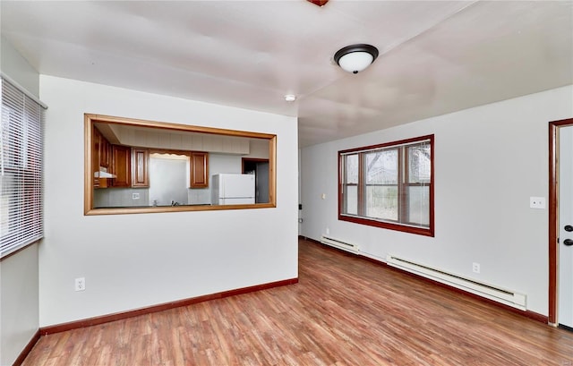 1991 State Highway H, Sikeston, MO 63780 - unfurnished living room with a baseboard radiator, wood finished floors, and baseboards