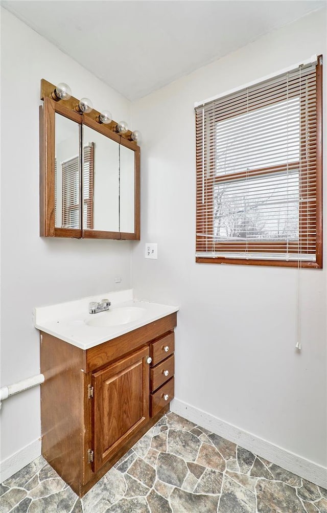 1991 State Highway H, Sikeston, MO 63780 - bathroom featuring baseboards, stone finish floors, and vanity